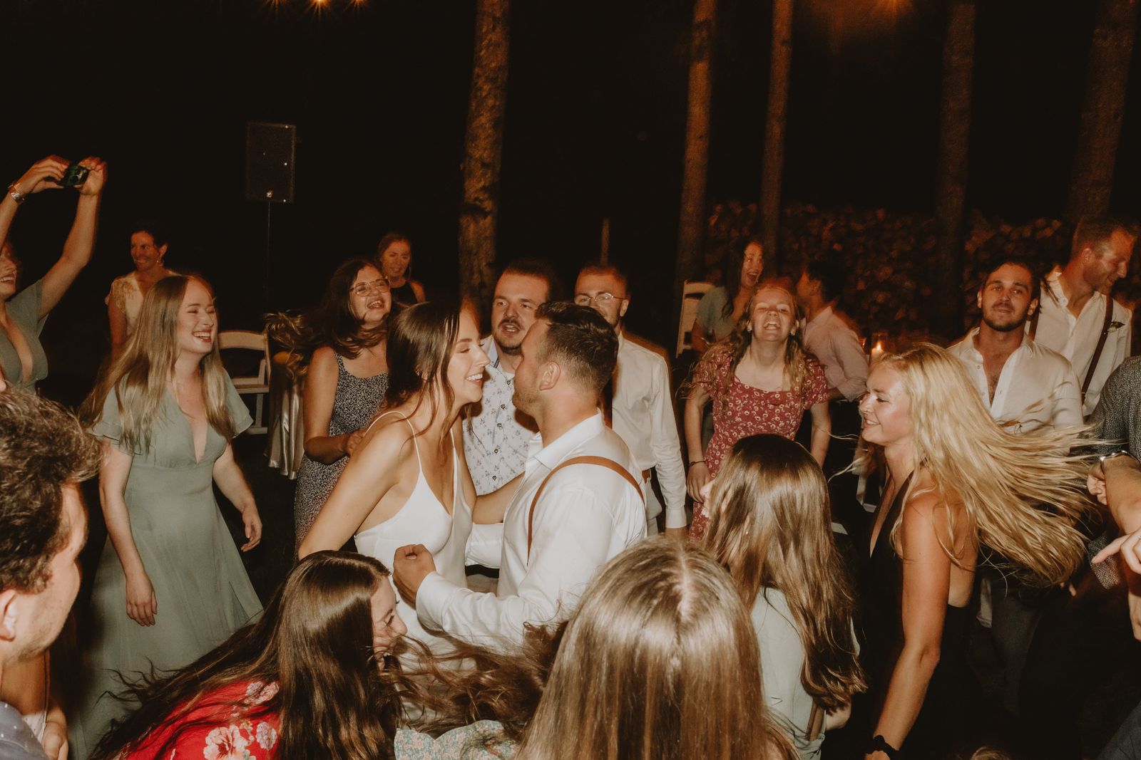 Guests on a lively dance floor at night