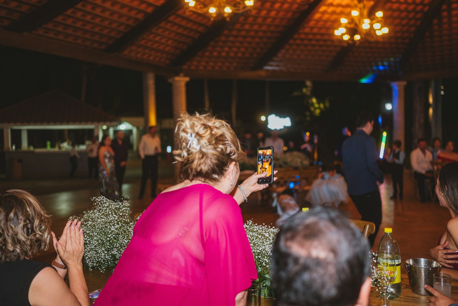 Guests cheering at an outdoor reception