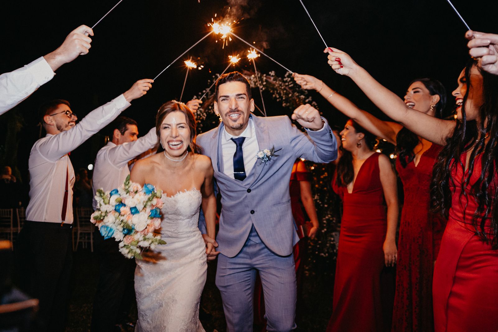 Couple walking under sparklers